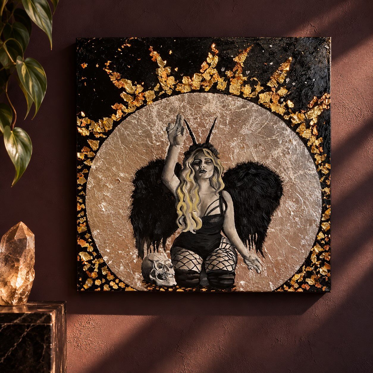 Dark feminine angel with black wings and gold leaf